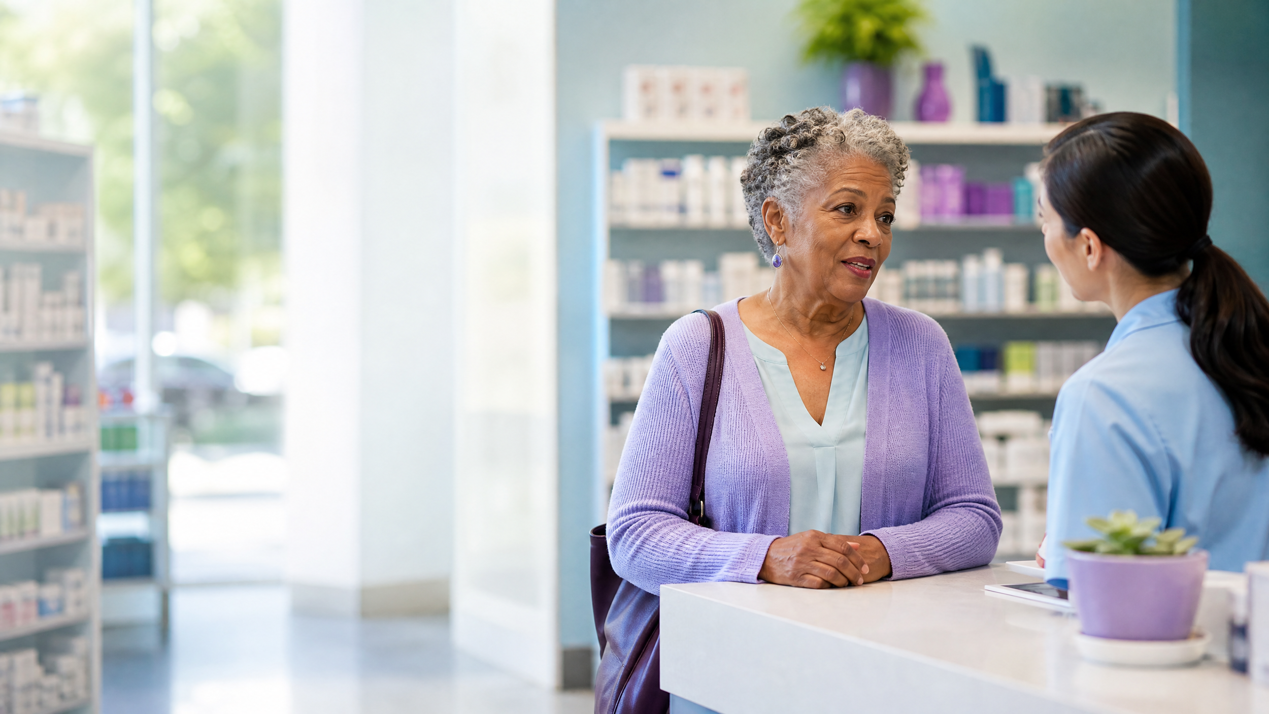 Older woman discussing prescription costs with a pharmacist at a pharmacy counter