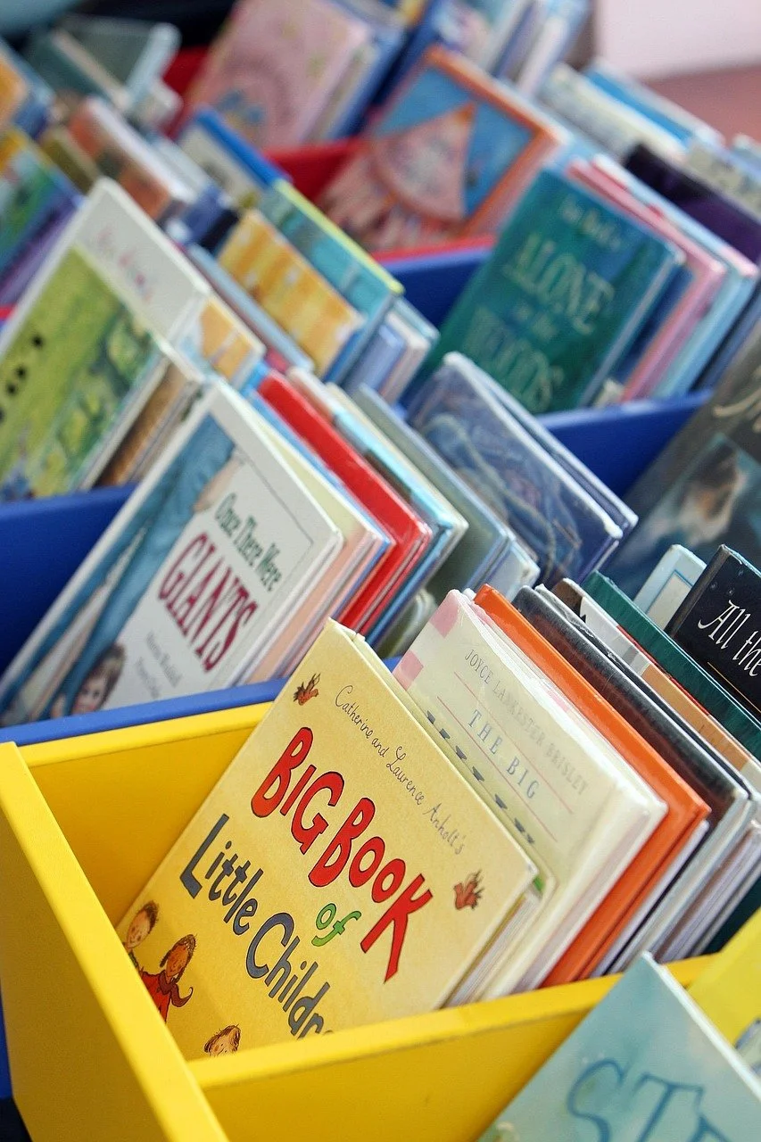 Colorful children's books in a bin, gifts for toddlers that aren't toys