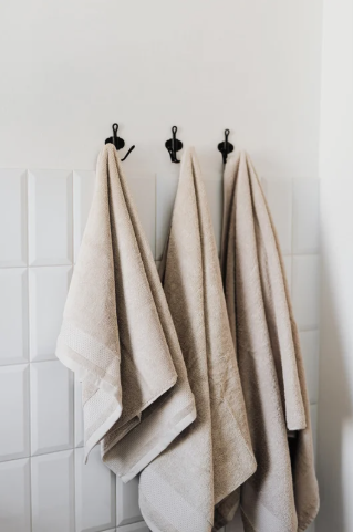 Shower towels hanging on hooks