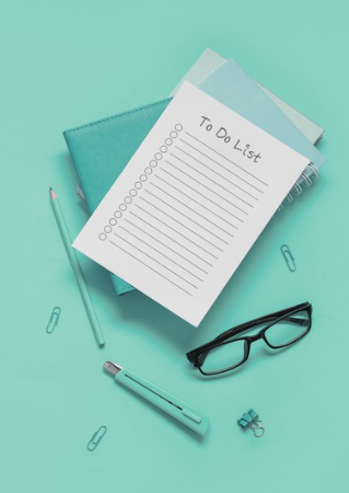 To-do list with eye glasses and pen