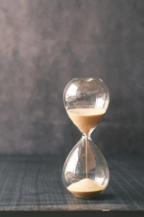 Small hourglass timer with sand