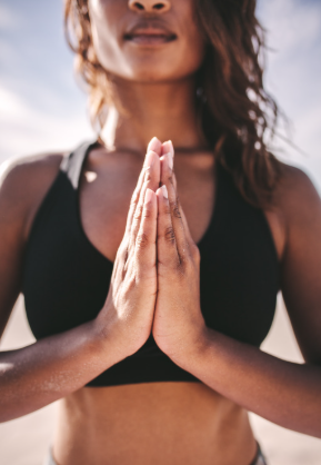 Woman with palms together setting an intention