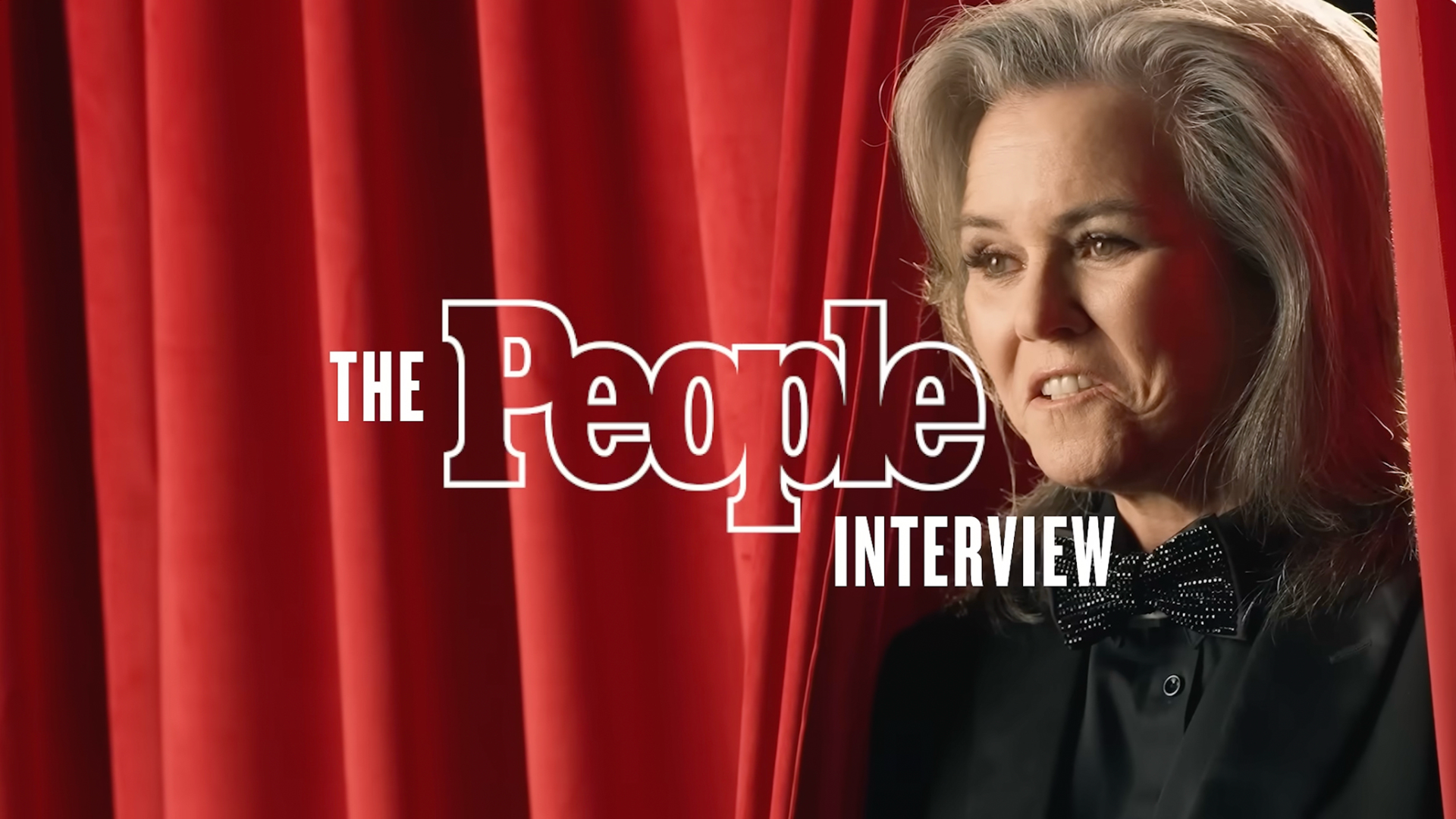 Rosie O’Donnell seated in front of red theater curtains, with “The People Interview” graphic overlaid beside her.
