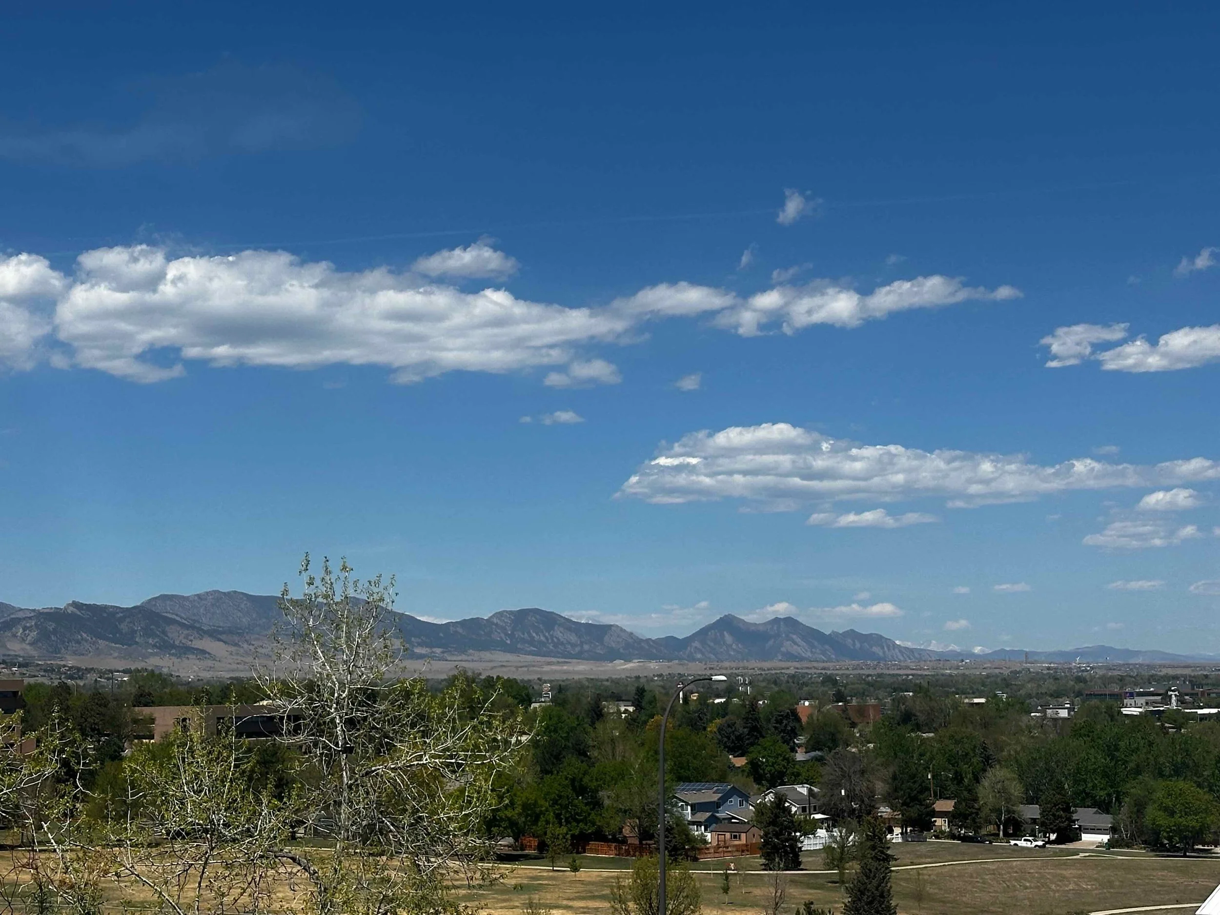 View of the Colorado Flatirons from a residential asbestos inspection job site on Vivian St in Lakewood, CO