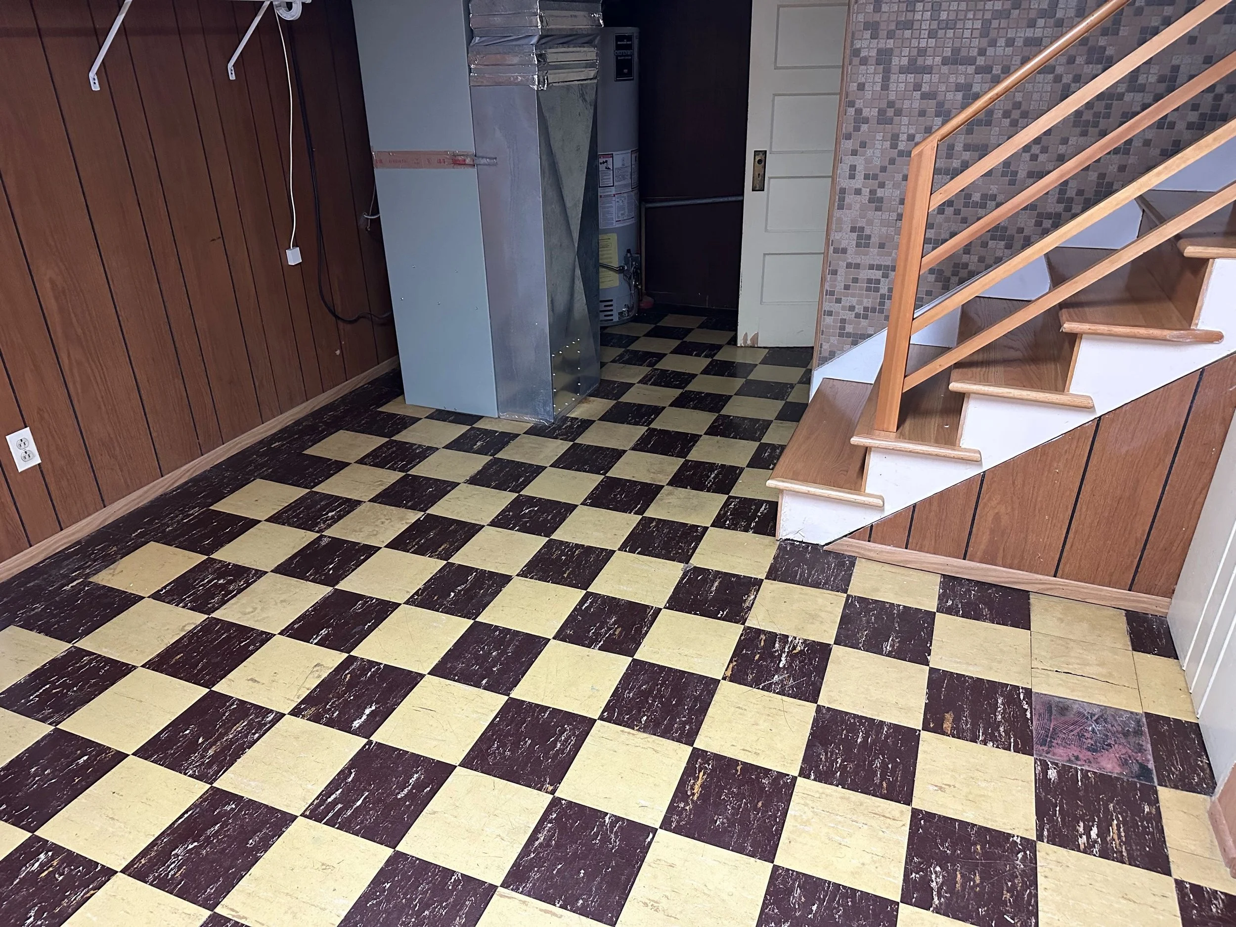 Close-up of vintage 9 x 9 floor tiles common in older Colorado homes.