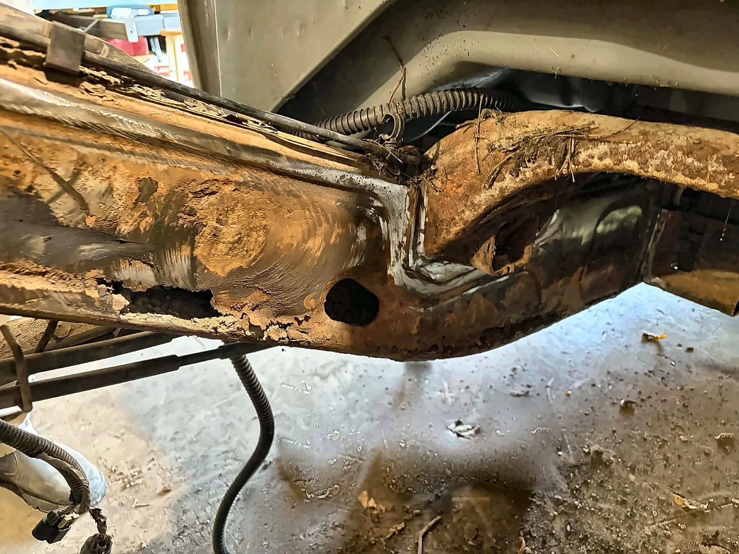 Before: truck frame rail rusted through