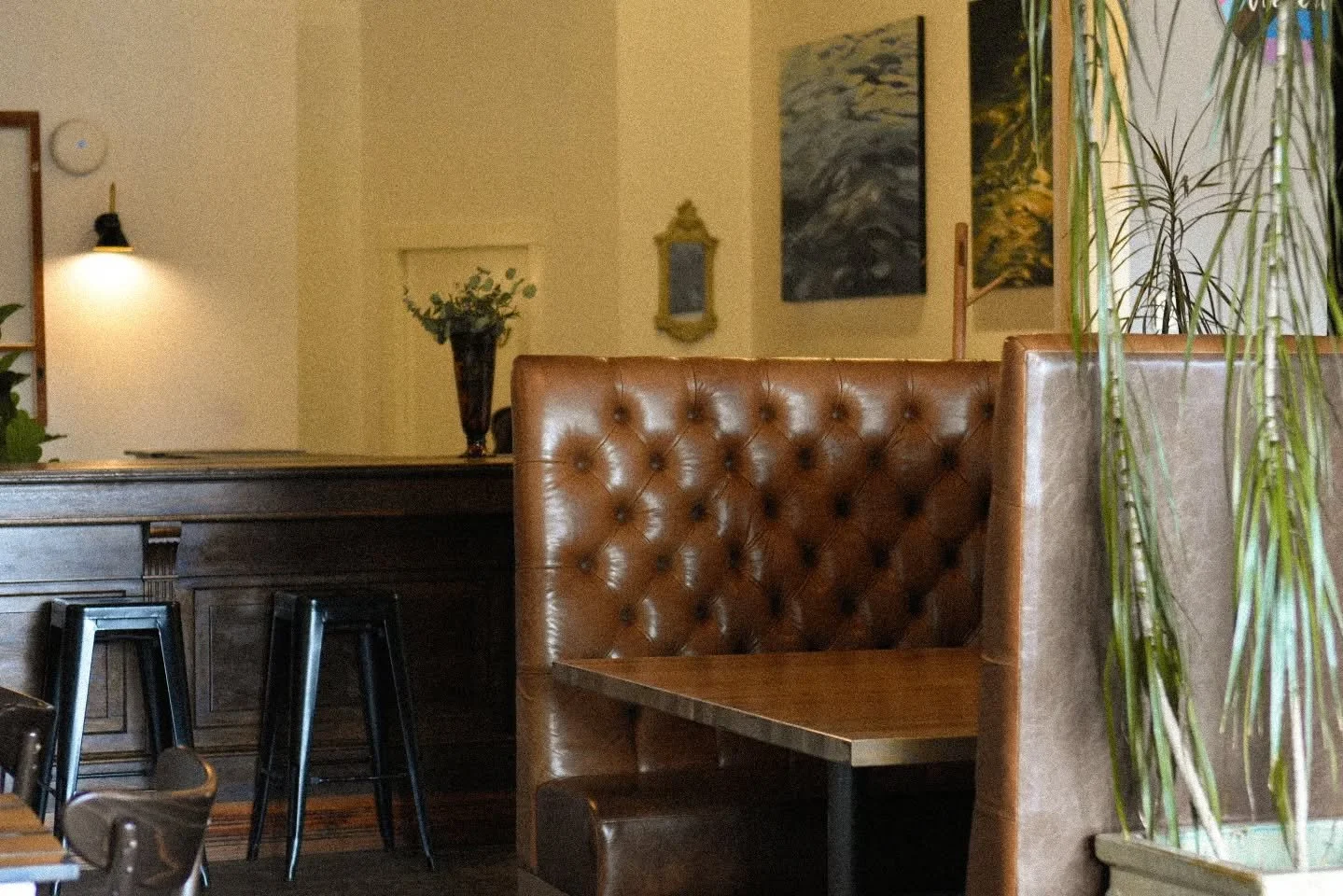 There&rsquo;s something about this space the moment you walk in.
Warm leather booths, soft light, natural textures, and that quiet buzz of conversation in the background. It feels cozy, calm, and just a little bit special,

&mdash; like the kind of p