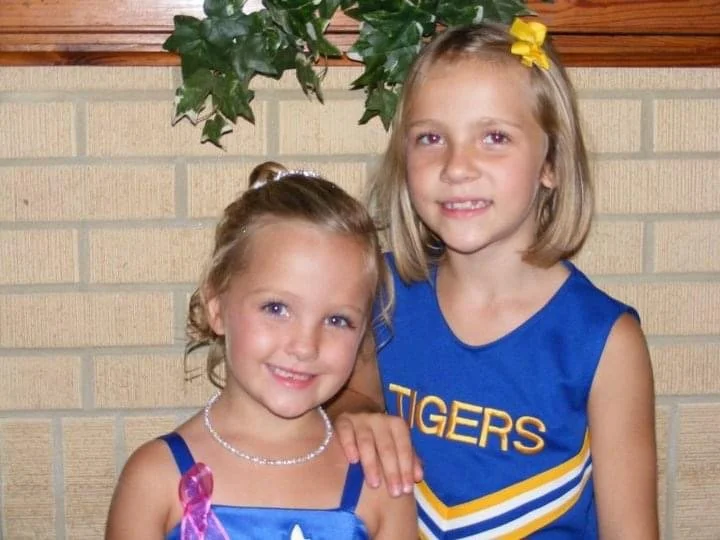 Age 8 with older sister