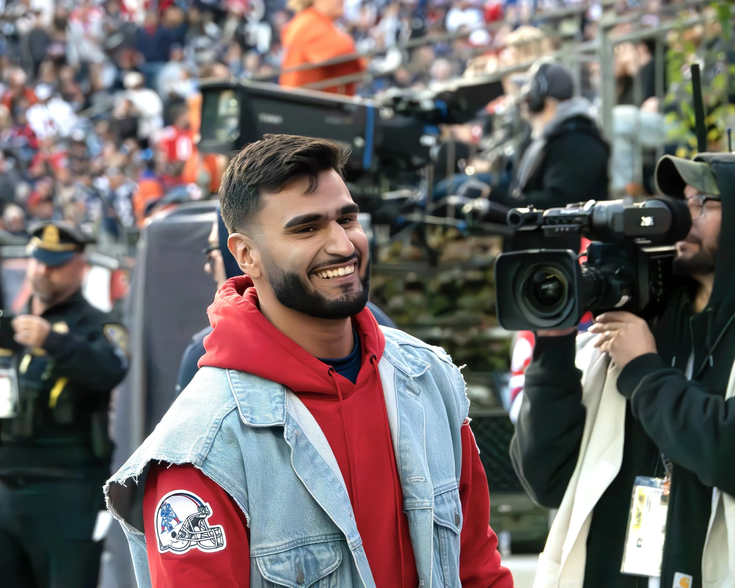 Jayden Becker serving as on-field emcee for the New England Patriots at Gillette Stadium during a live NFL game.