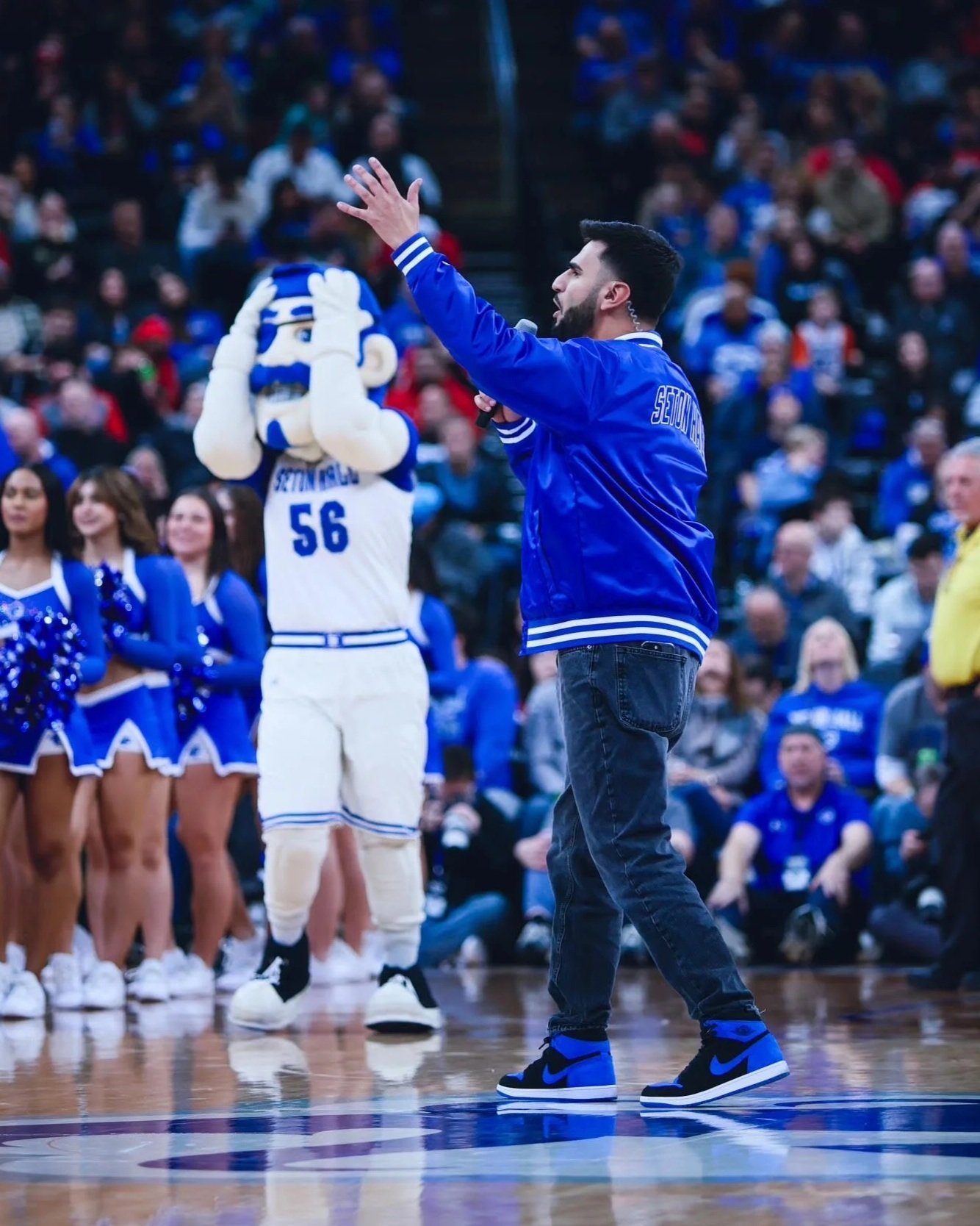 Jayden Becker serving as the in-arena host for Seton Hall men’s basketball at Prudential Center, engaging fans during a Big East college basketball game.