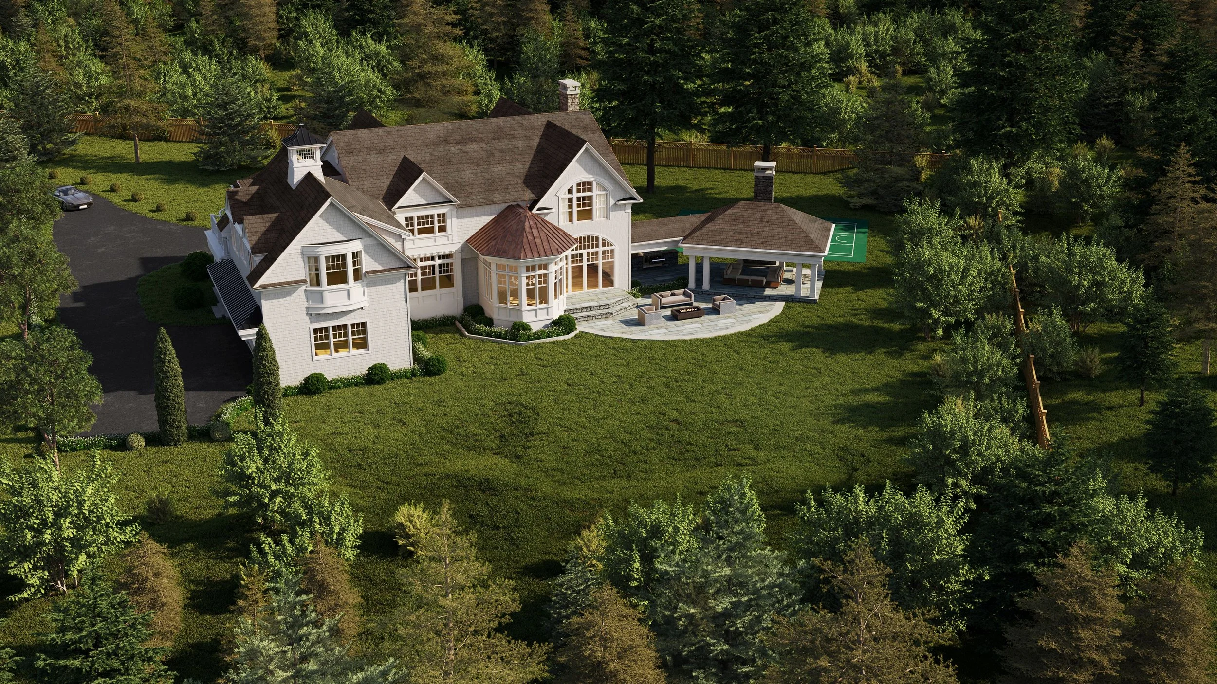 Aerial view of a large suburban house surrounded by greenery with a driveway and patio area.