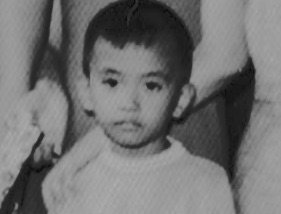 The Little Boy in the Baptism Photograph
