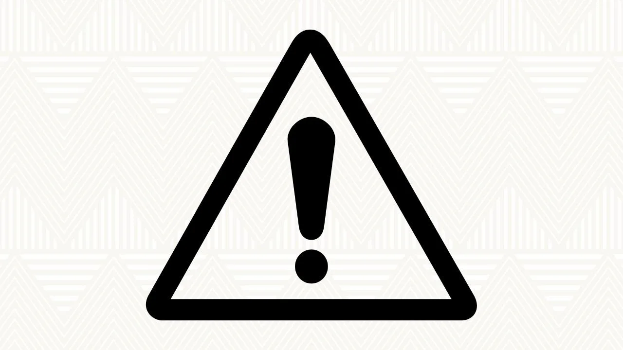 Warning sign with exclamation mark inside a triangle.