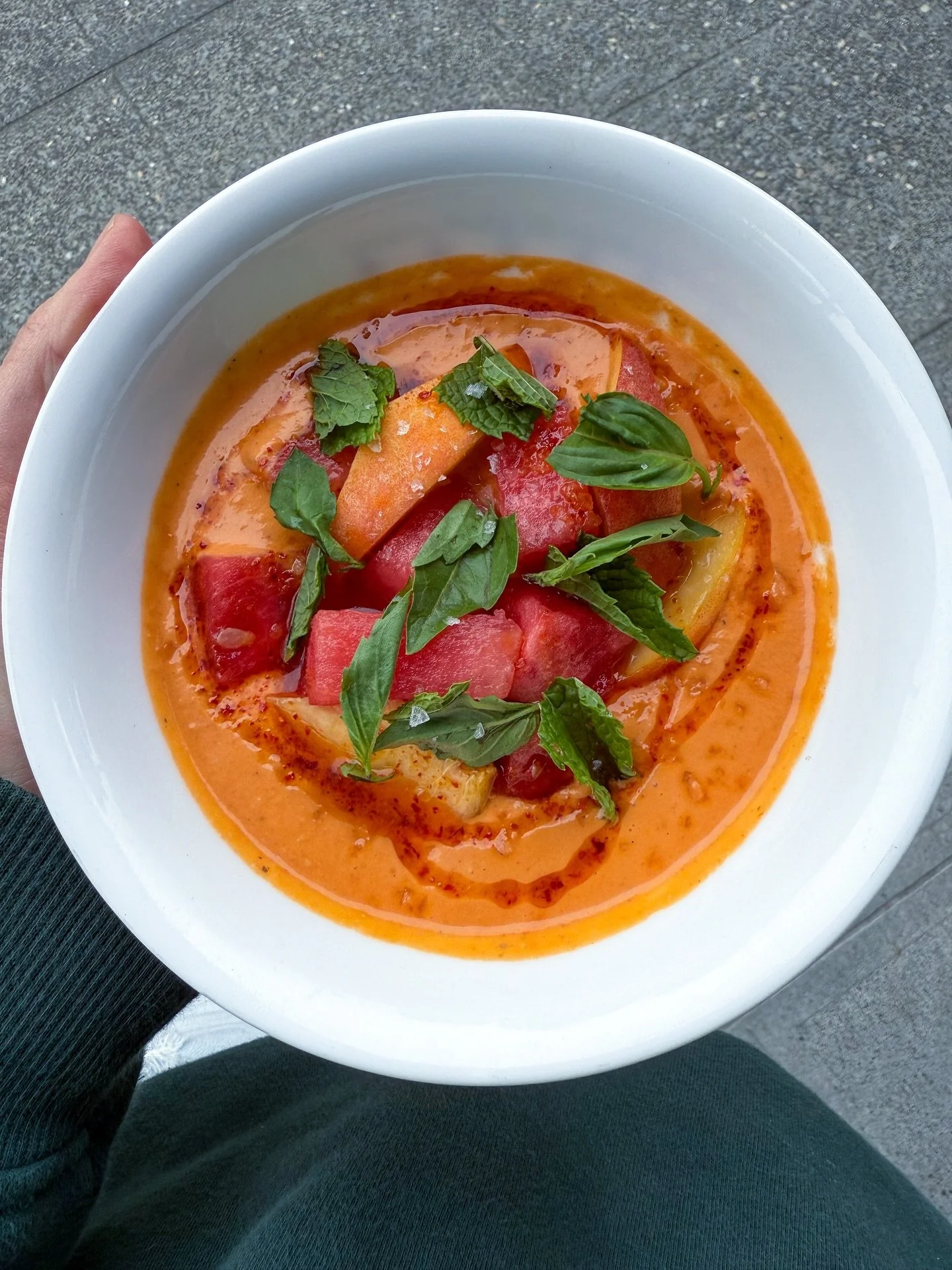 Phew, now that the heatwave is over, we have Salmorejo topped with watermelon, peaches, Aleppo oil and fresh herbs. 
//
Salmorejo is a thicker, creamier Spanish version of its cousin Gazpacho. Ours highlights sun-gold tomatoes, and is thickened with 