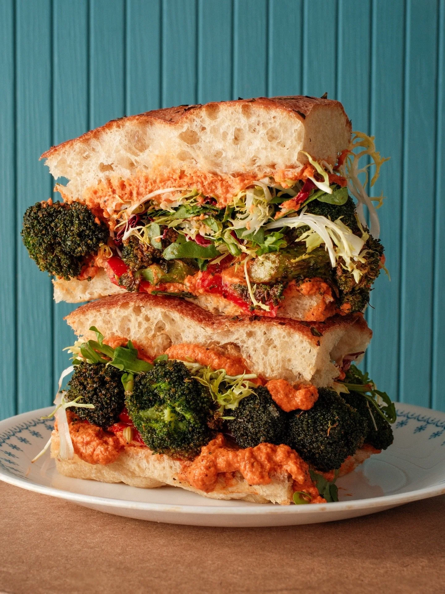 Florets &amp; The Machine; fried broccoli, almond romesco, pickled goat horn peppers &amp; chicories on herby focaccia. Large, in charge, and vegan.