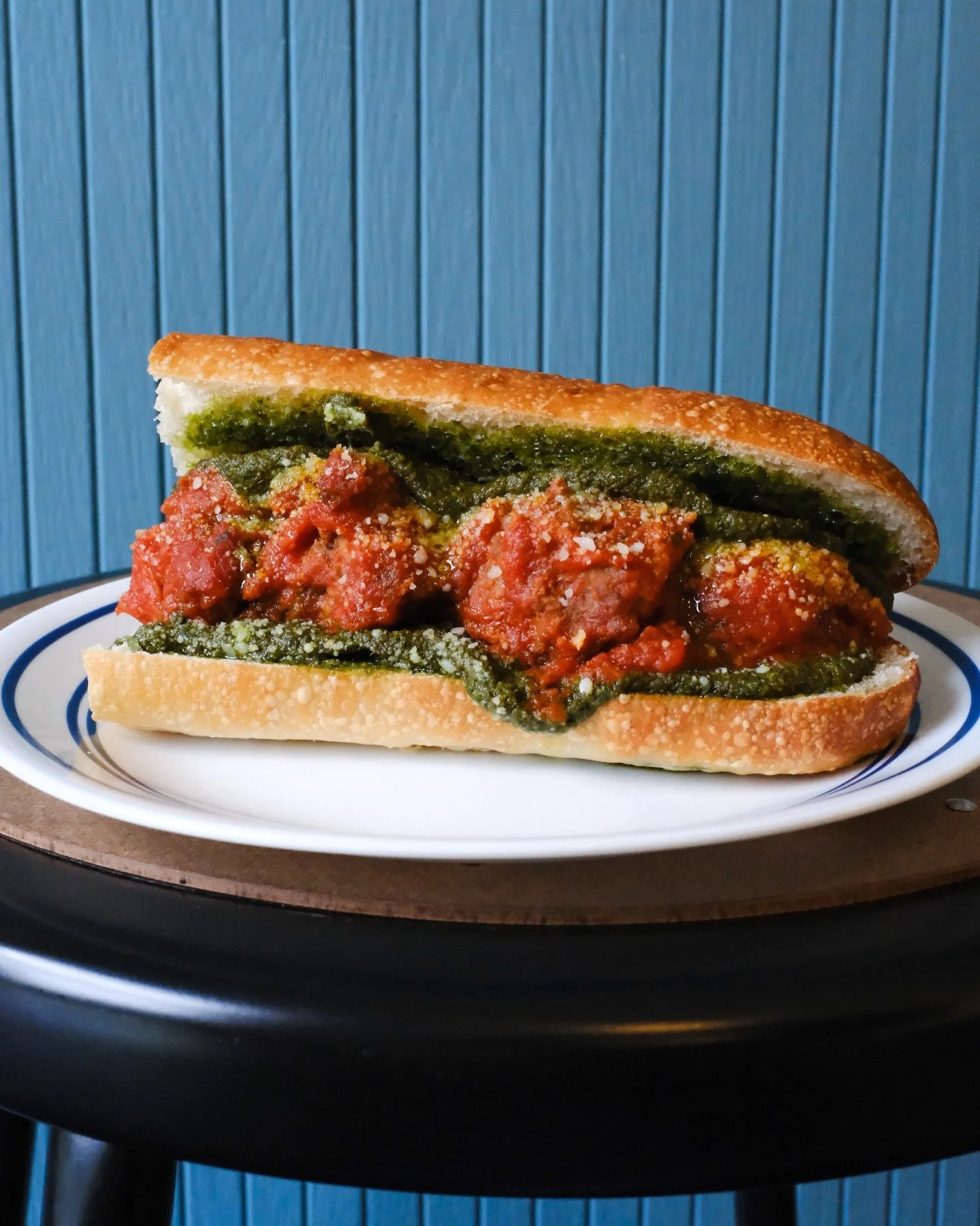 Carlton Farms pork and beef meatballs, tomato sugo (that&rsquo;s tomato sauce folks), pesto and Parmesan on a toasted hoagie. Limited daily! Come early and plan to get messy. 
//
You think you see four meatballs in this pic, but it&rsquo;s two cut in