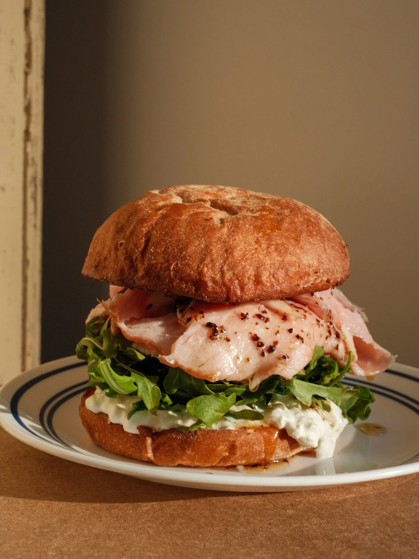 Ahem! You&rsquo;re going to want to read this description - and then immediately make your way over for this 💎 local Jack Mountain ham, stracciatella cheese, truffle honey and arugula on a potato bun.