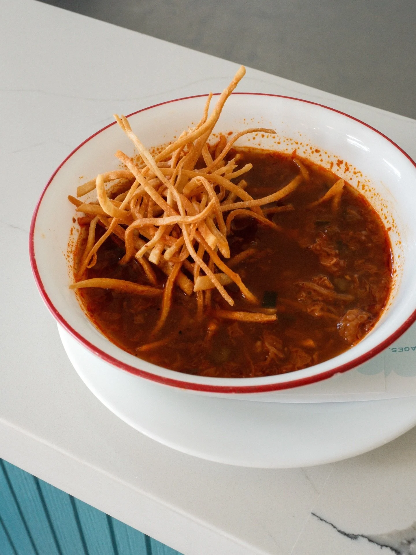 Spicy Vegetable Pozole topped with crispy tortilla strips. 
Full of life, heat, and chicken stock - absolutely perfect for this cold week we are having.