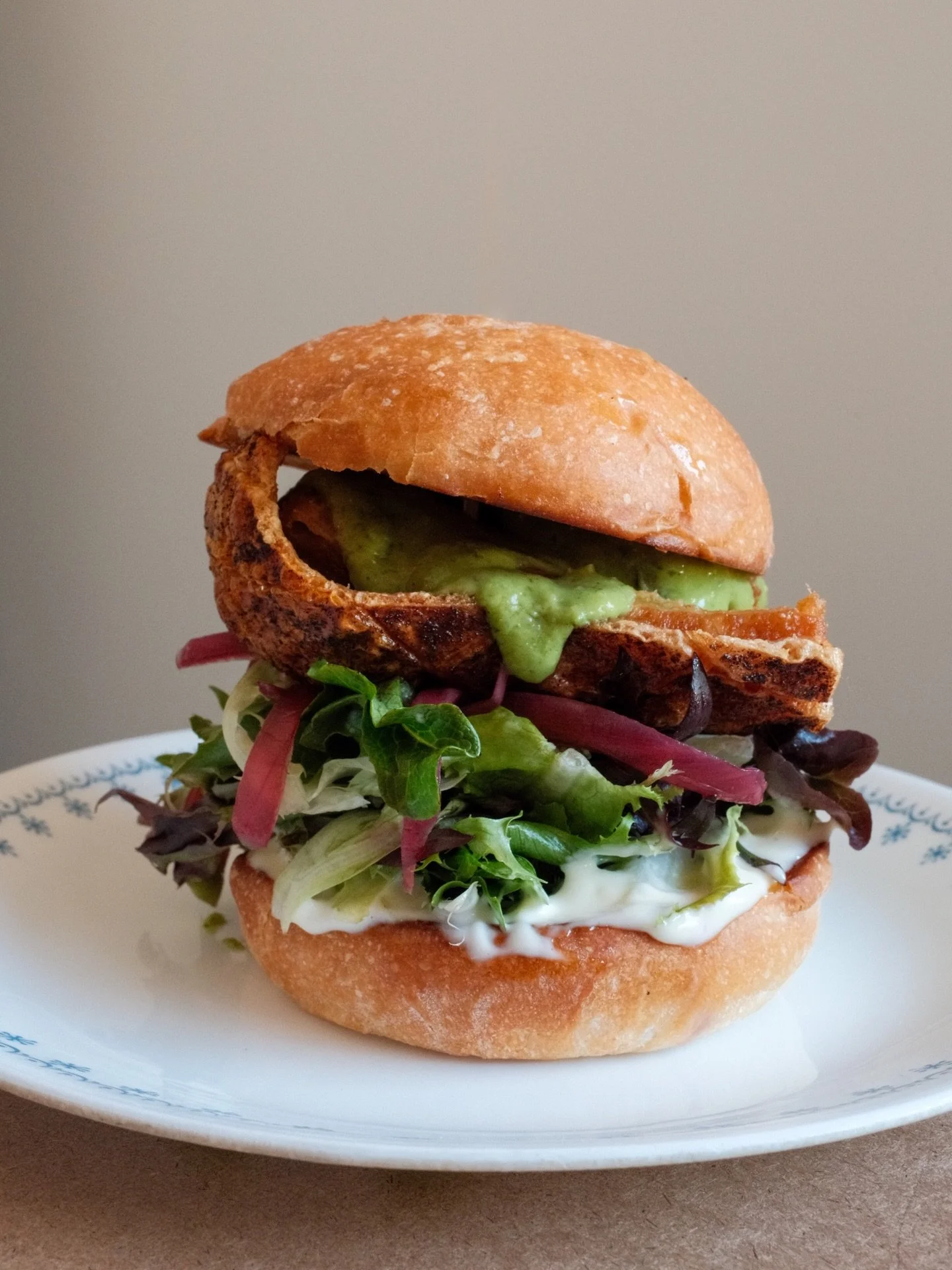 Yall are going to want to phone a friend on this one! Crispy (skin on!) Pork Belly is in the specials board this week - slow roasted until tender, fried until crisp, with pickled hibiscus onion, aioli, crisp lettuces and tomatillo-avocado salsa on a 