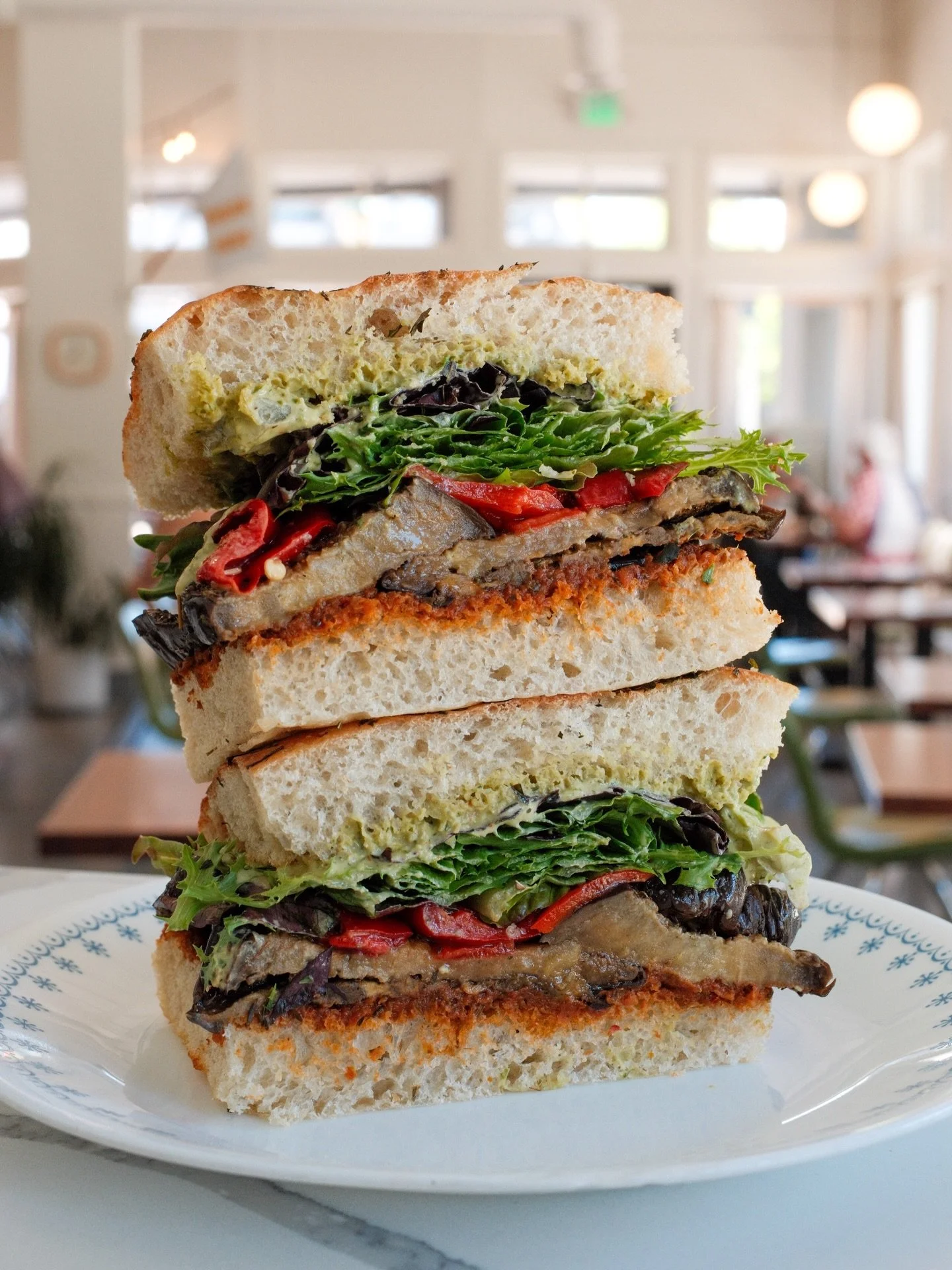 Standing tall as the Atlas Mountains, is our ✨new✨ vegan sandwich, The Atlas. Za&rsquo;atar roasted eggplant, @villajerada chermoula, green tahini, pickled goat horn peppers and arugula on @grandcentralbakery herby focaccia.