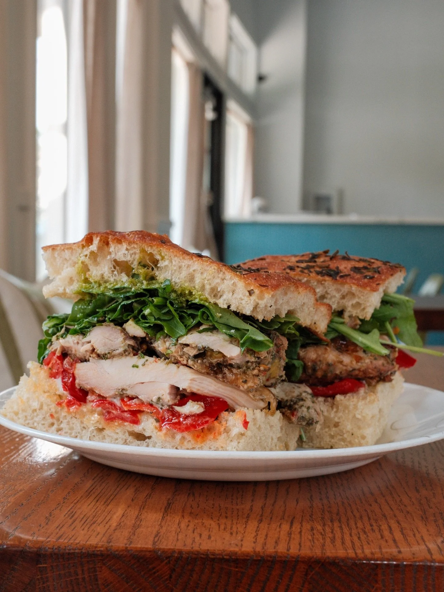 There&rsquo;s a new chicken sandwich in town, meet Pesto Manifesto. Marinated and roasted chicken thigh, nut-free pesto, pickled goat horn peppers, aioli &amp; arugula on focaccia. #onthemenu #summersandwich #chickenpesto