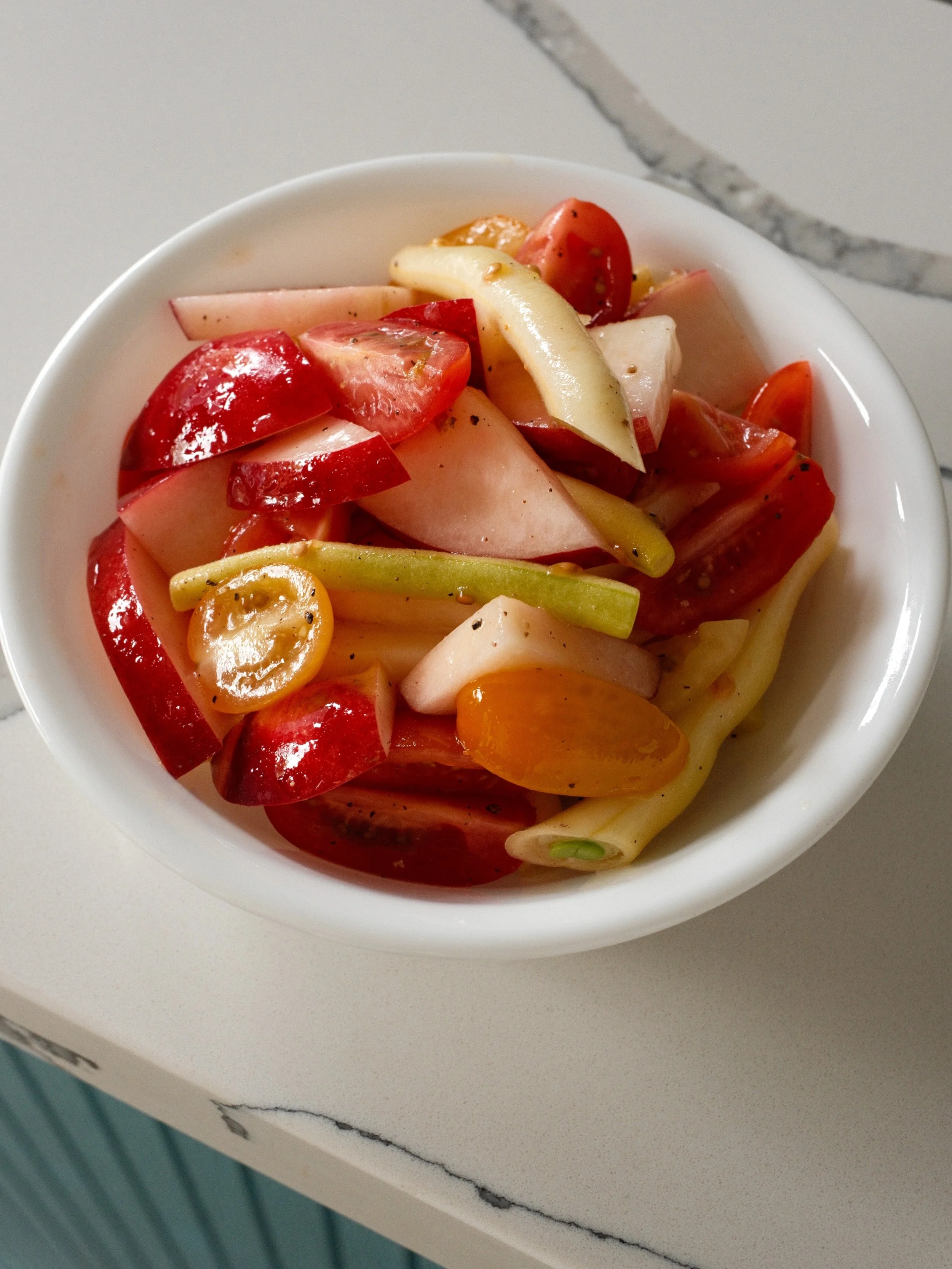 Do you feel produce peaking?! We do!! New special; a side salad of white nectarine, heirloom tomatoes and yellow wax beans.