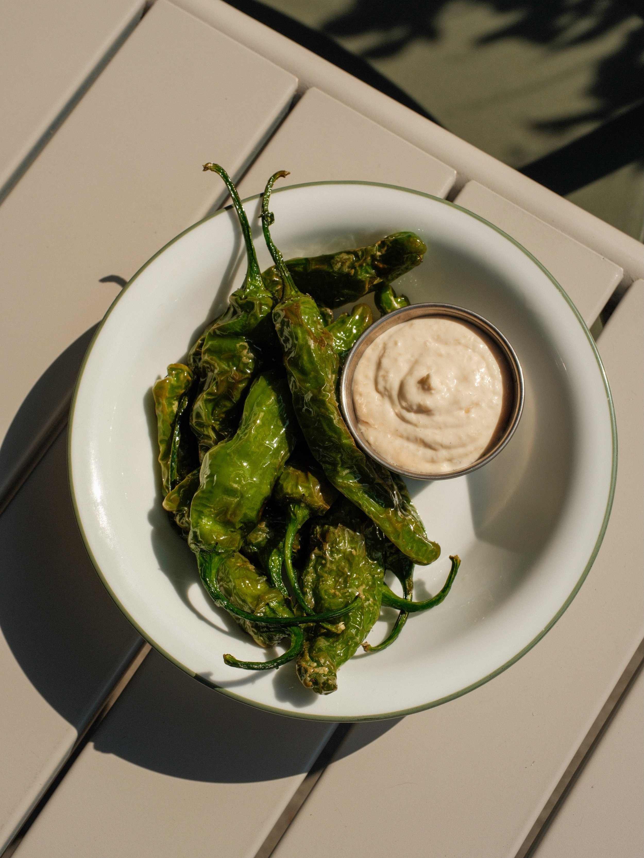 Pepper roulette is the name of the game!! Blistered shishito peppers and Walla Walla onion aioli are on the spec board. One in ten-ish is spicy!!