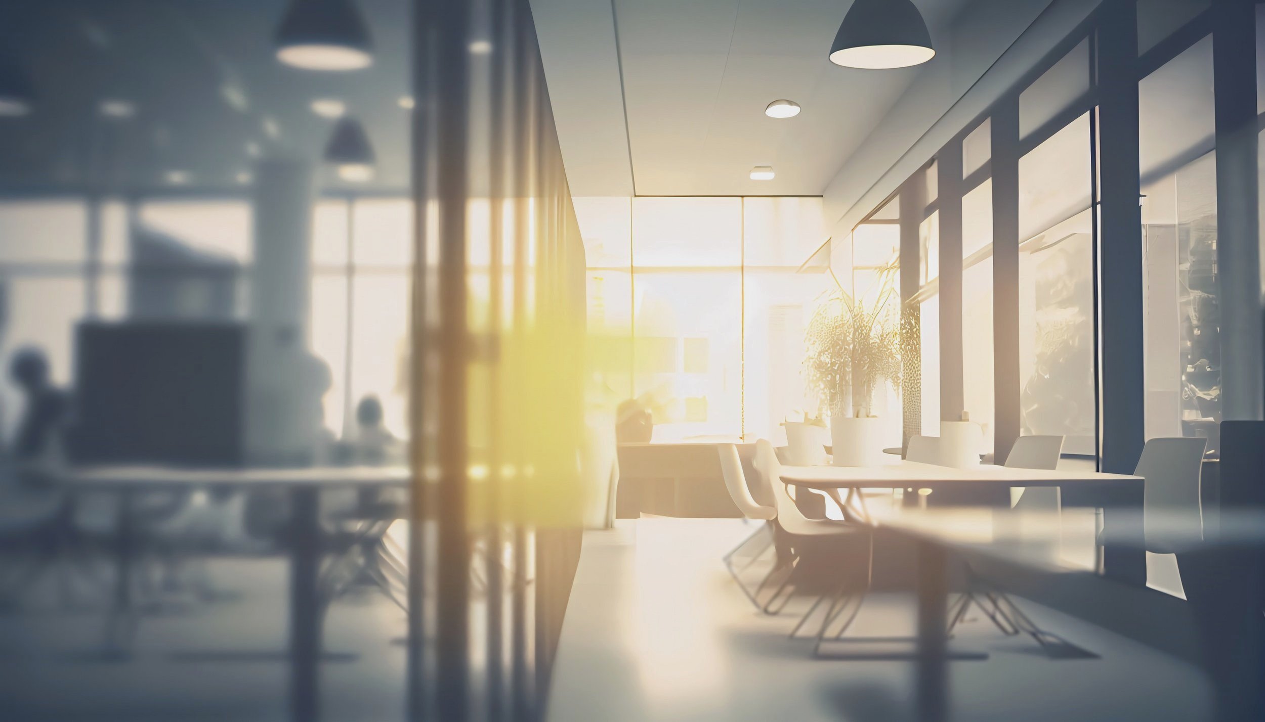 modern-business-office-without-people-with-blurred-bokeh-background-tables-chairs-computers-copy-space-2.jpg