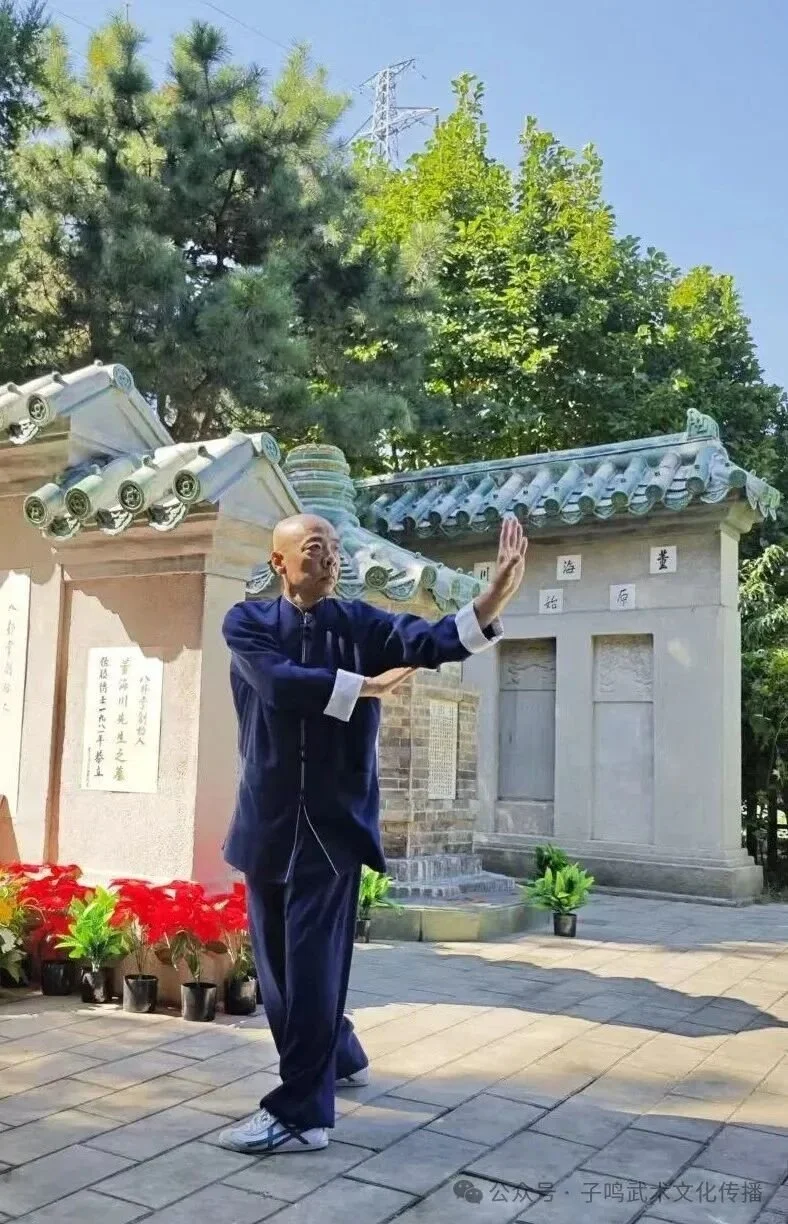 Practitioner in blue demonstrating Baguazhang at the restored tomb