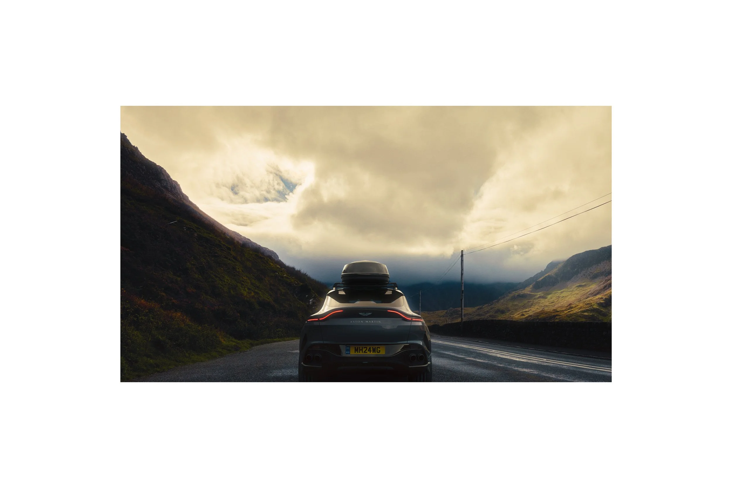 Automotive advertising image of a luxury SUV in a dramatic highland environment, highlighting professional CGI integration, digital compositing, and premium photo retouching.