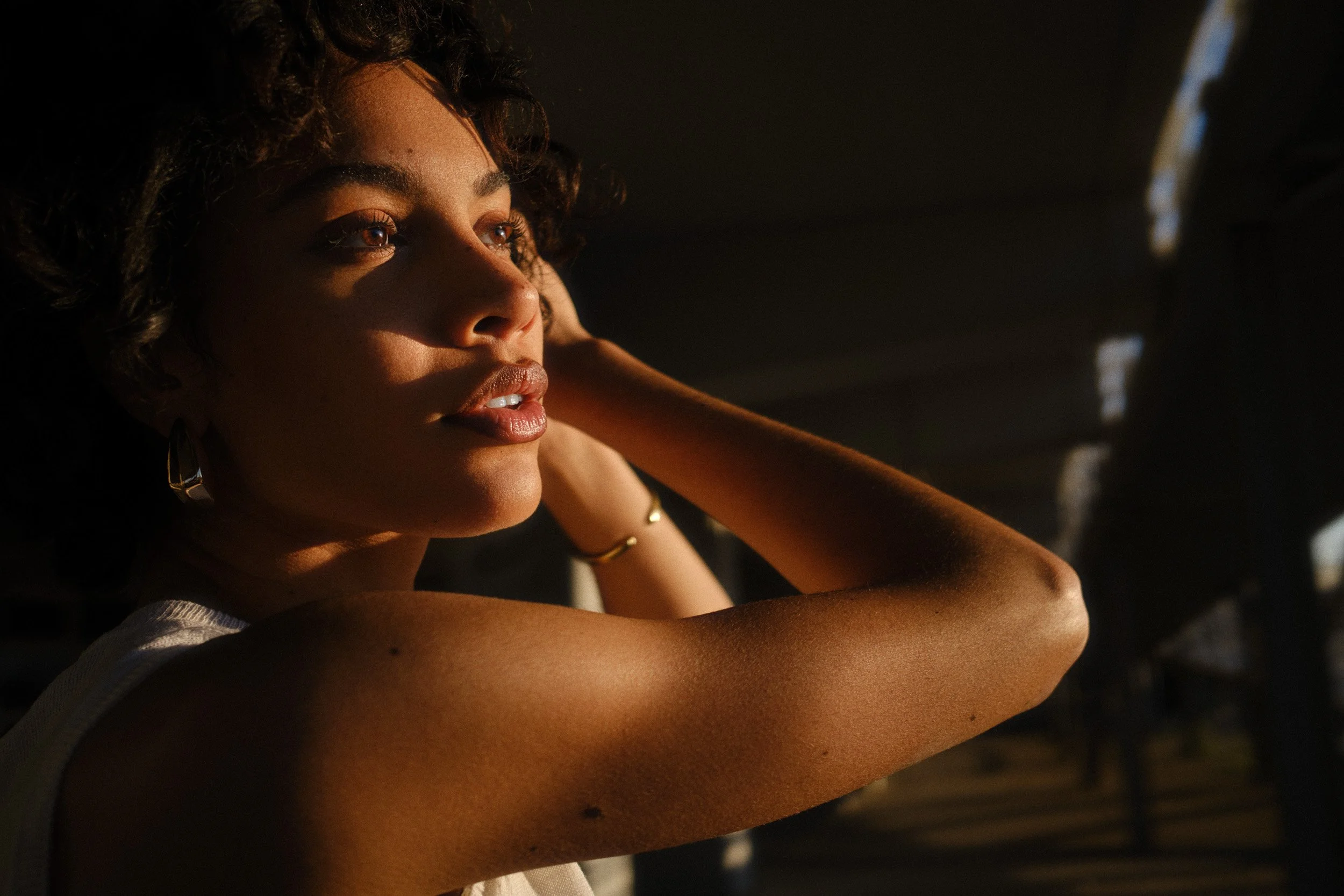 Automotive advertising image of woman on steps with Lancia Ypsilon. Automotive photography, CGI, retouching, postproduction, lifestyle
