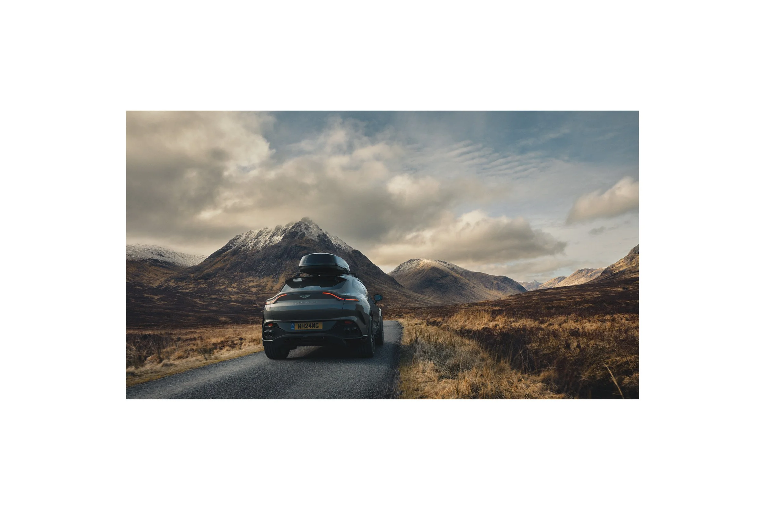 Automotive advertising image of a luxury SUV in a dramatic highland environment, highlighting professional CGI integration, digital compositing, and premium photo retouching.