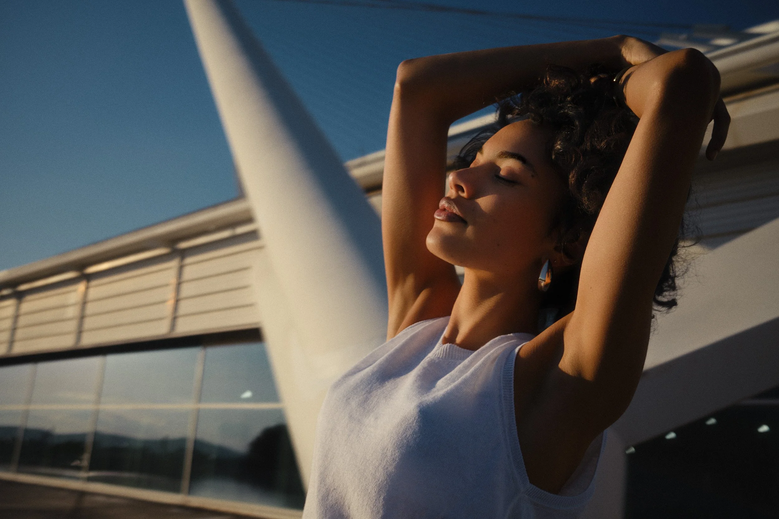 Automotive advertising image of woman on steps with Lancia Ypsilon. Automotive photography, CGI, retouching, postproduction, lifestyle