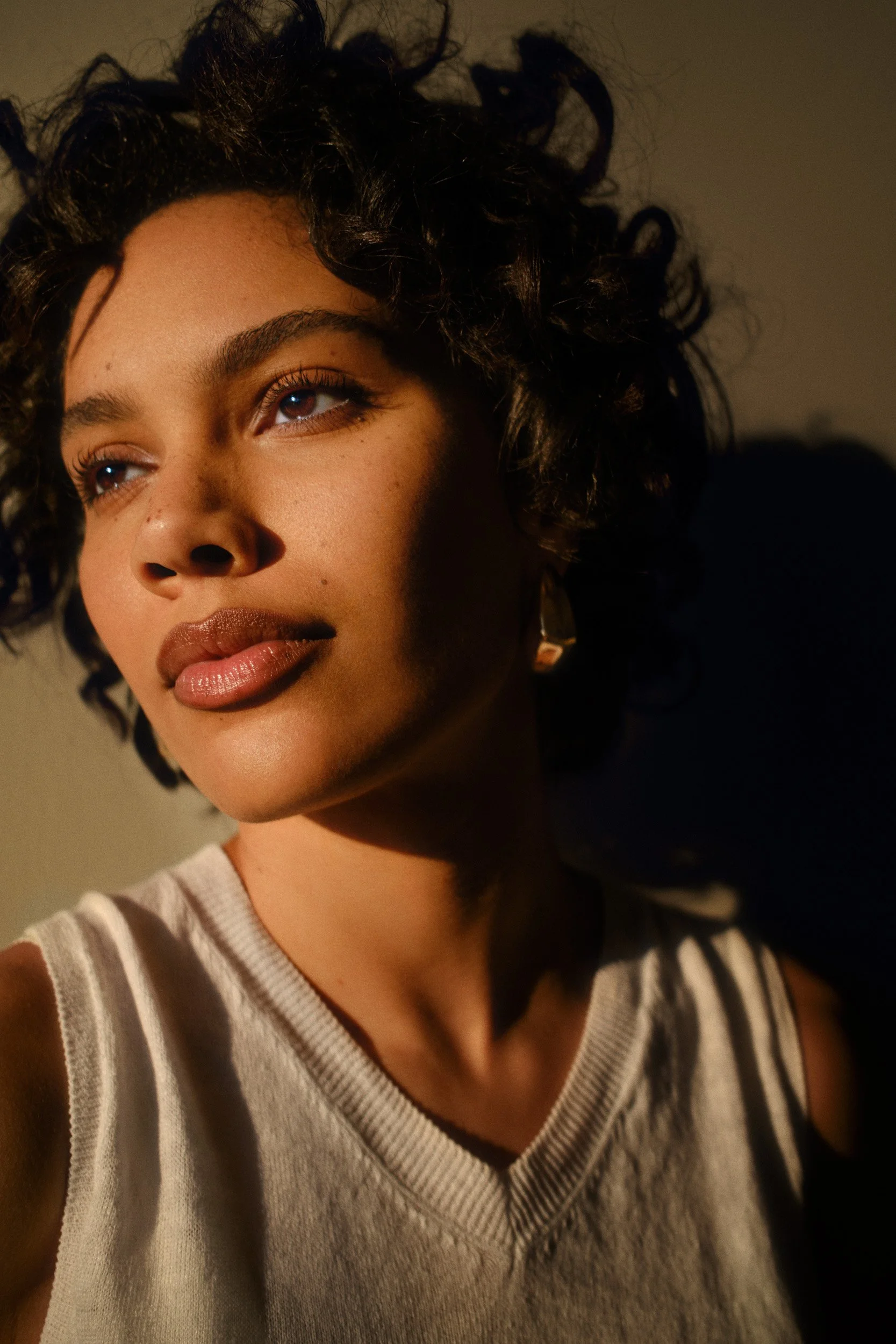 Automotive advertising image of woman on steps with Lancia Ypsilon. Automotive photography, CGI, retouching, postproduction, lifestyle