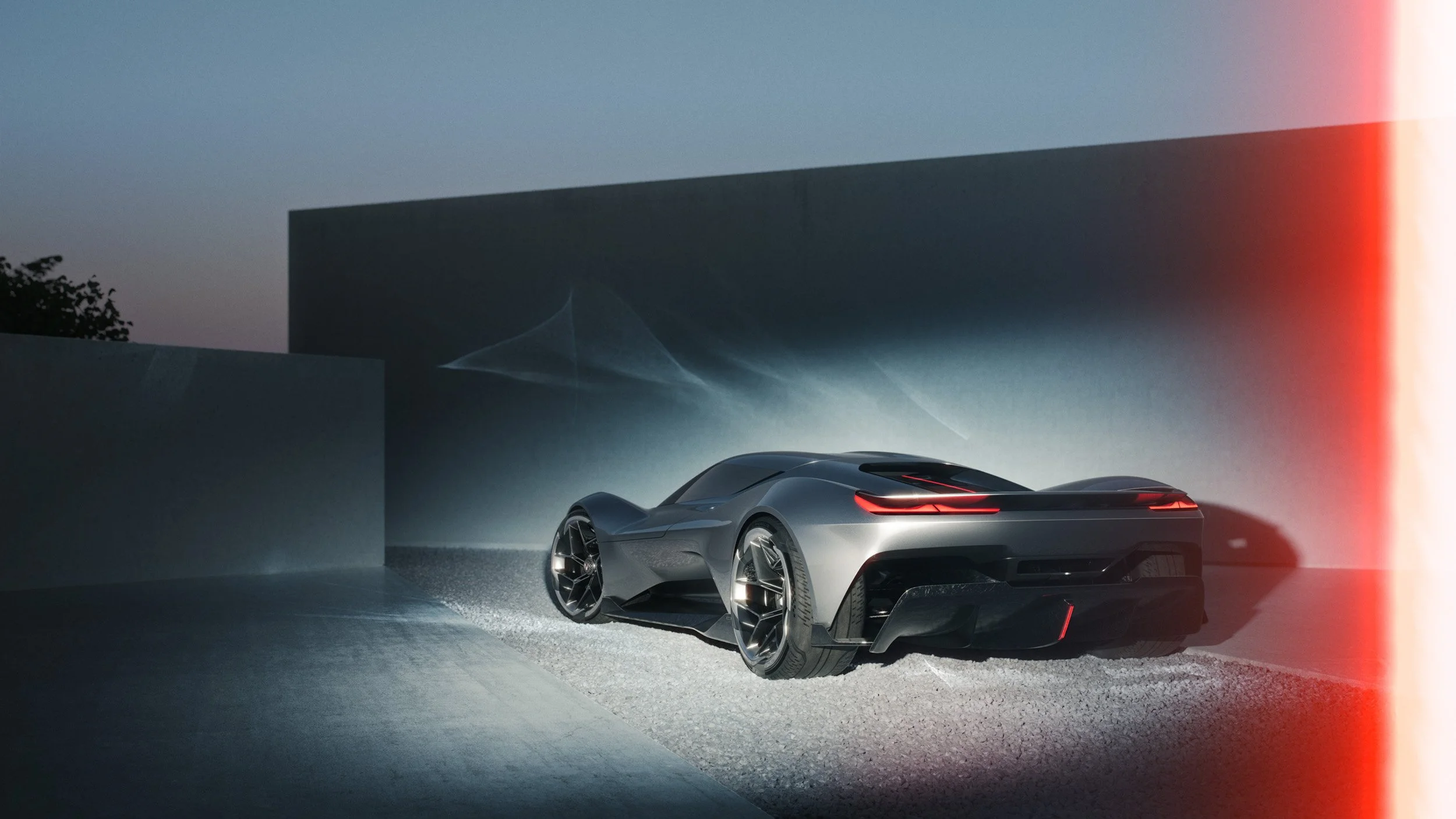 Premium automotive CGI render featuring a futuristic sports car with dramatic lighting and clean architectural backdrop, highlighting expert 3D visualization, compositing, and digital retouching.