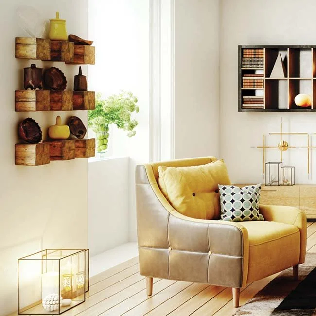 Modern living space with yellow armchair and shelving – Ramco Hilux calcium silicate board wall finish for durability and style.