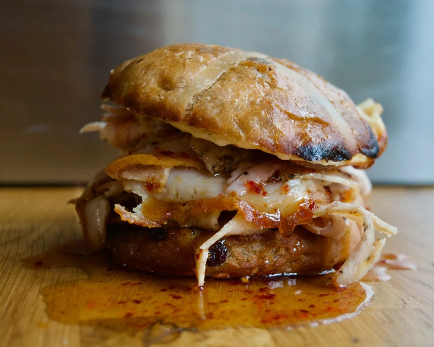 A little festive Easter special. 
Homemade hot cross bun, toasted in the wood fire oven with a slab of salted butter and smoked mozzarella. Topped with cold, wafer-thin sliced porchetta and doused in smoked chilli maple syrup. 
Sweet, salty, smoky. S
