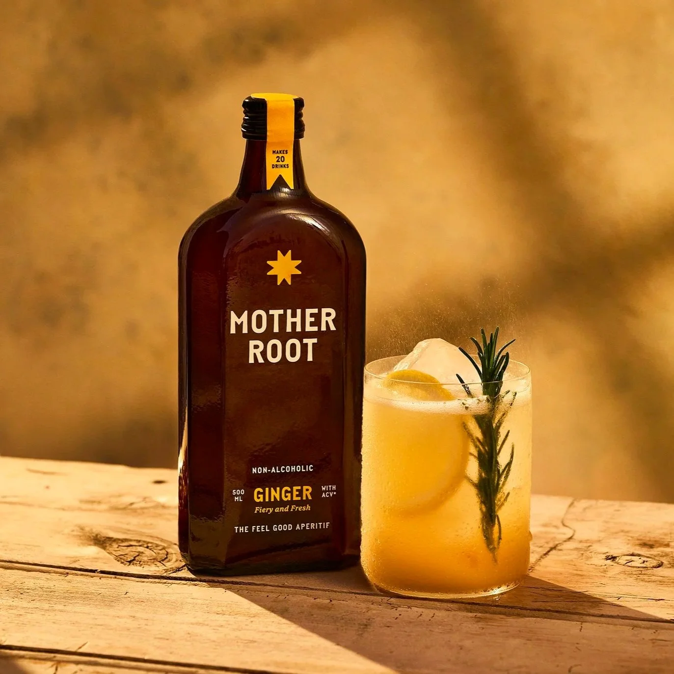 Mother Root with a glass.  Graphic Designer Creative Lead.