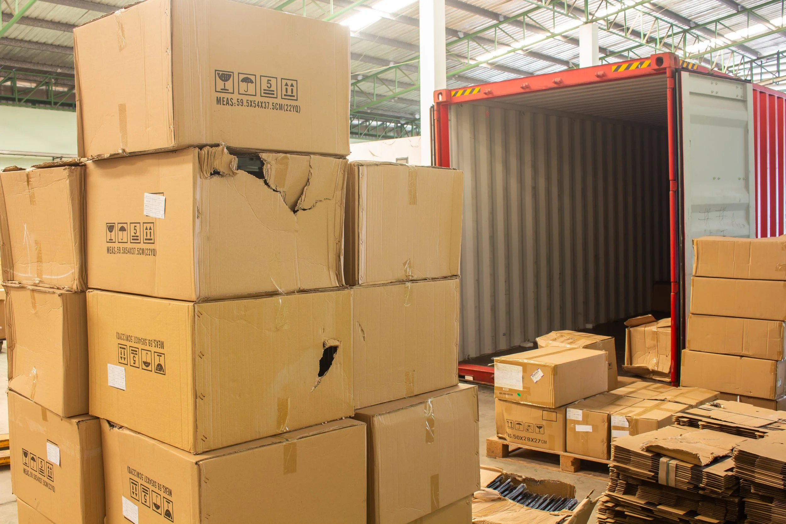 Image of busted boxes in a large warehouse.