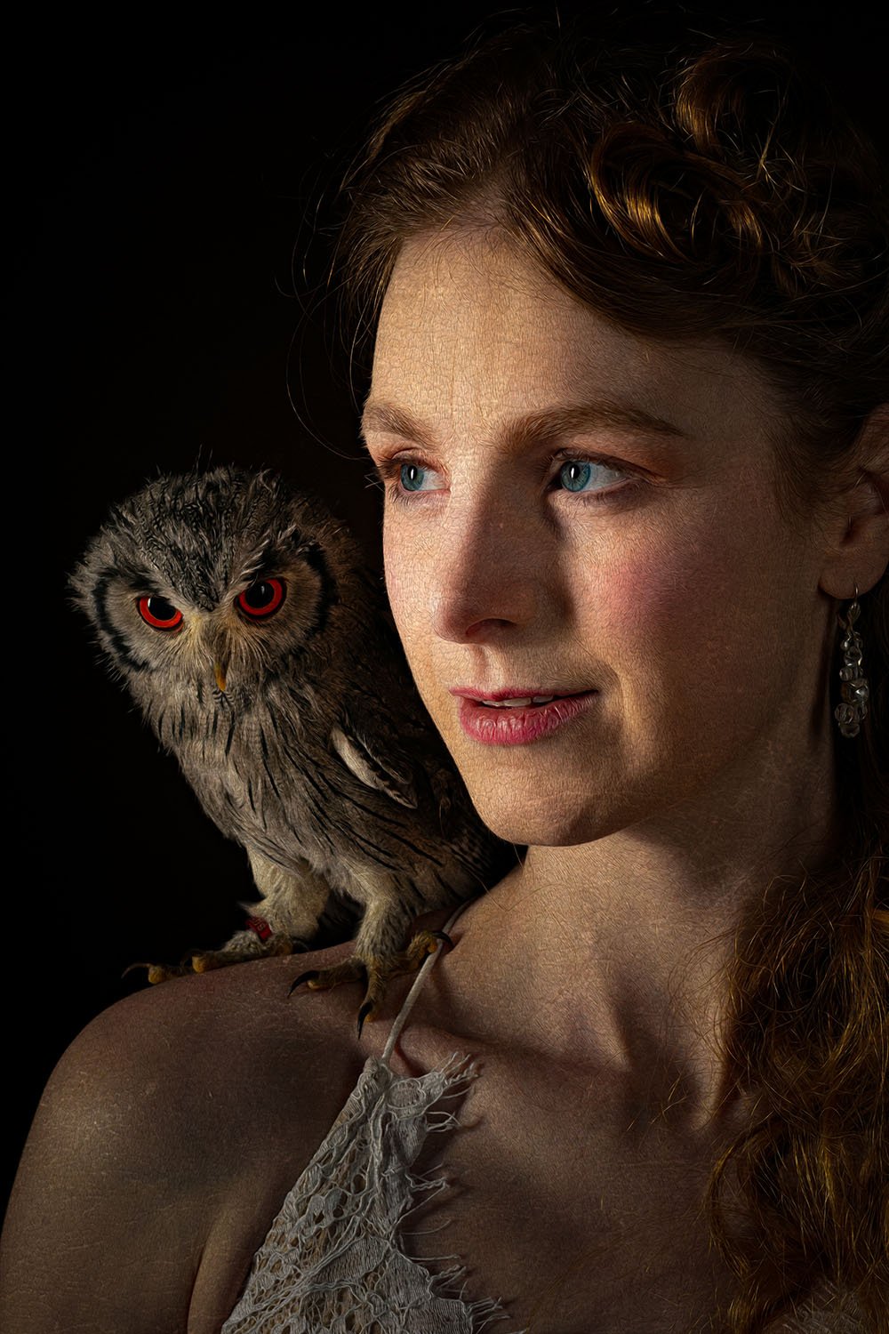 woman with a owl on her shoulder
