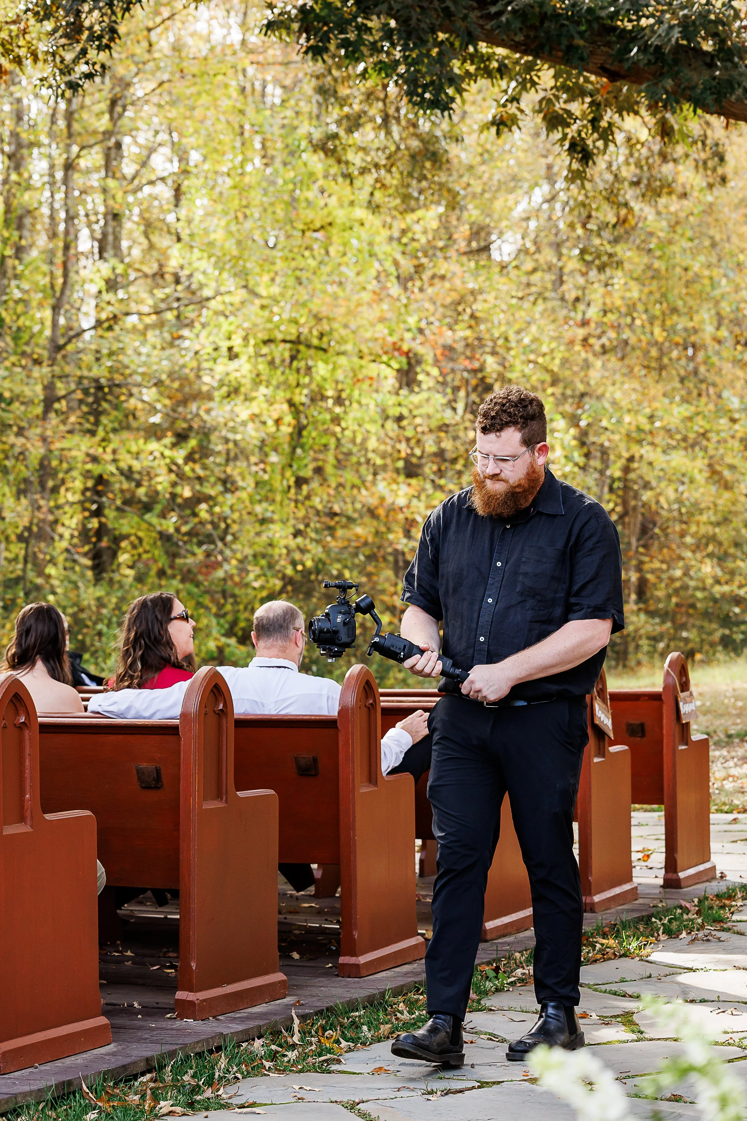 man recording ceremony before wedding in forest enchanted theme
