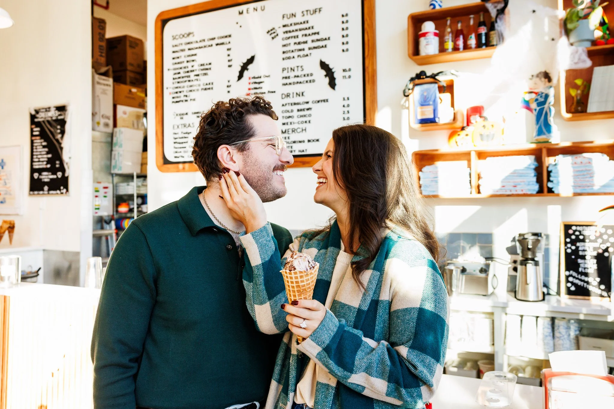 man and woman laughing in local  ice cream shop