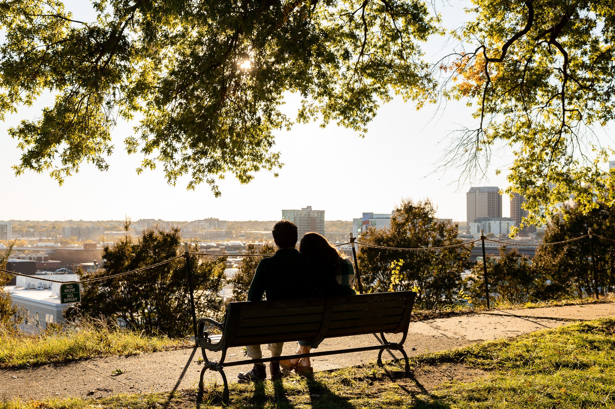 a couple viewing the richmond skyline during sunset