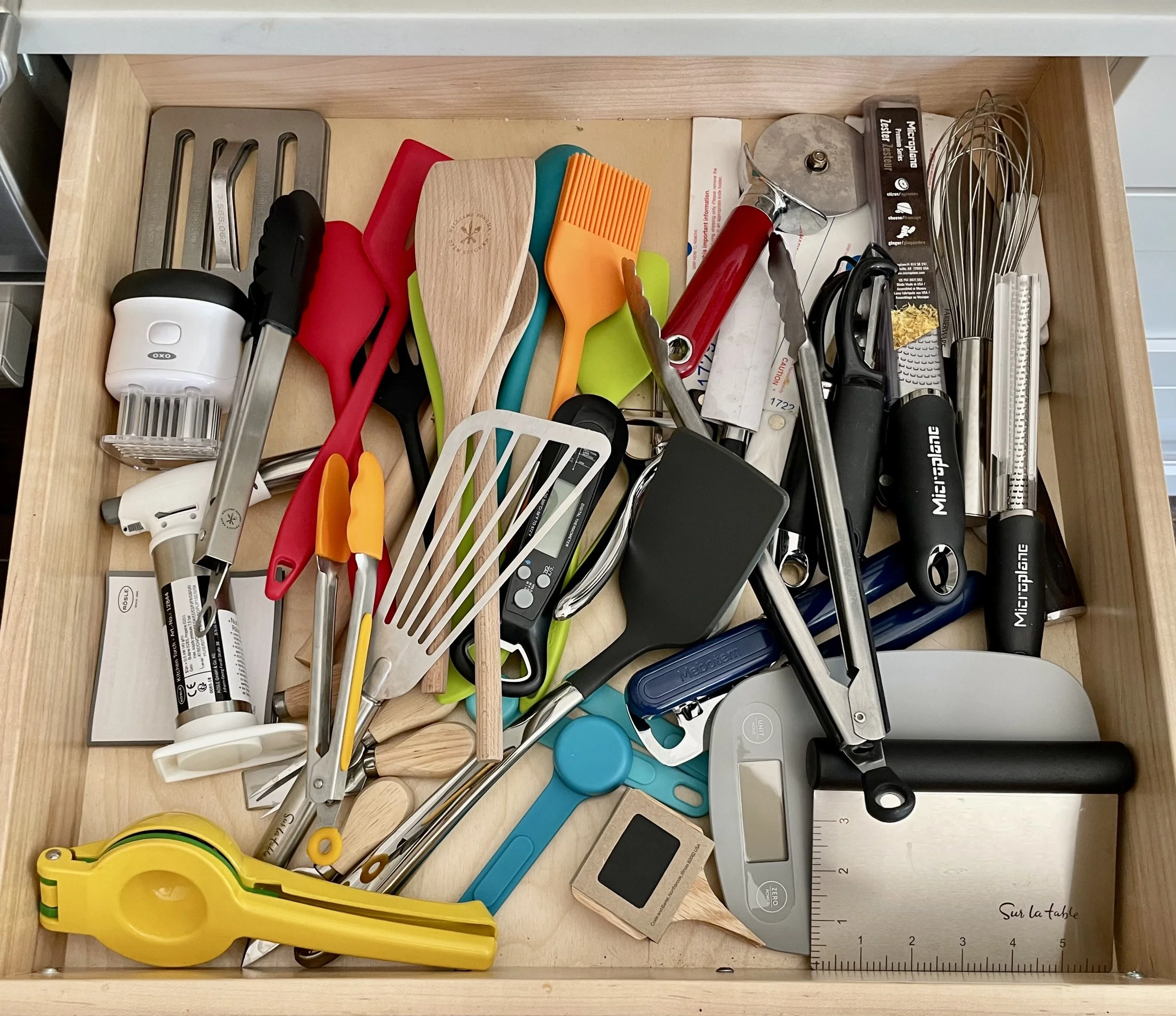 Professional Home Organizer in Chicago. Kitchen pantry drawers before organizing.