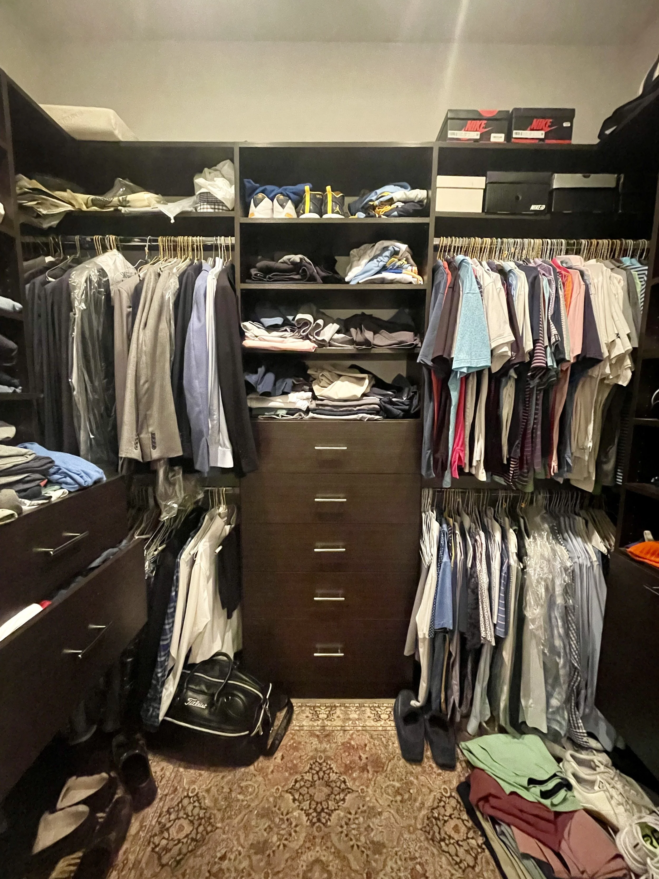 Professional Home Organizer in Chicago. Men's primary closet before organizing.