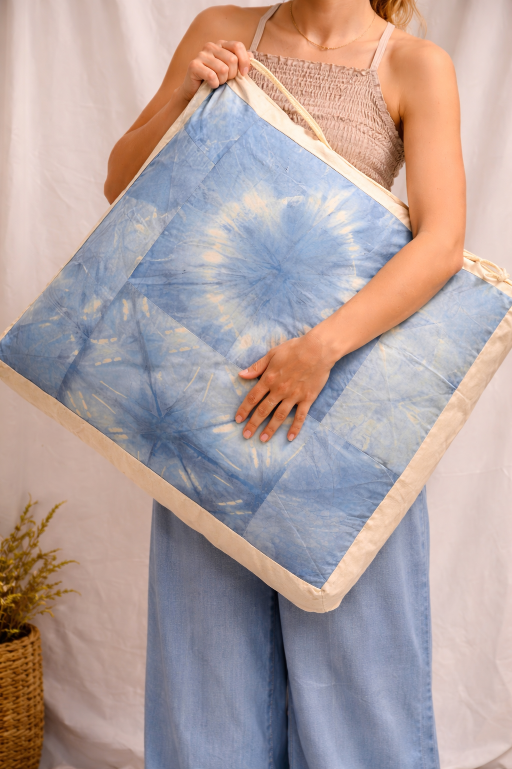 Woman Holding Floor Cushion .png