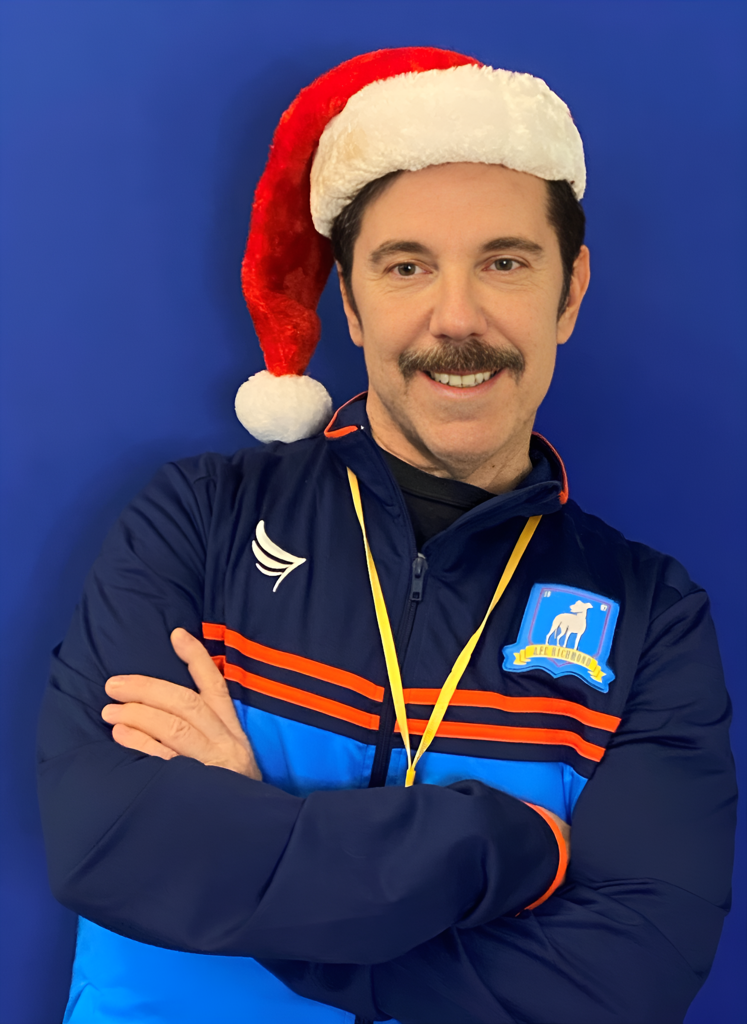 Ted Lasso with Santa Hat.png