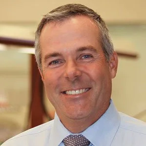 Smiling man in a shirt and tie