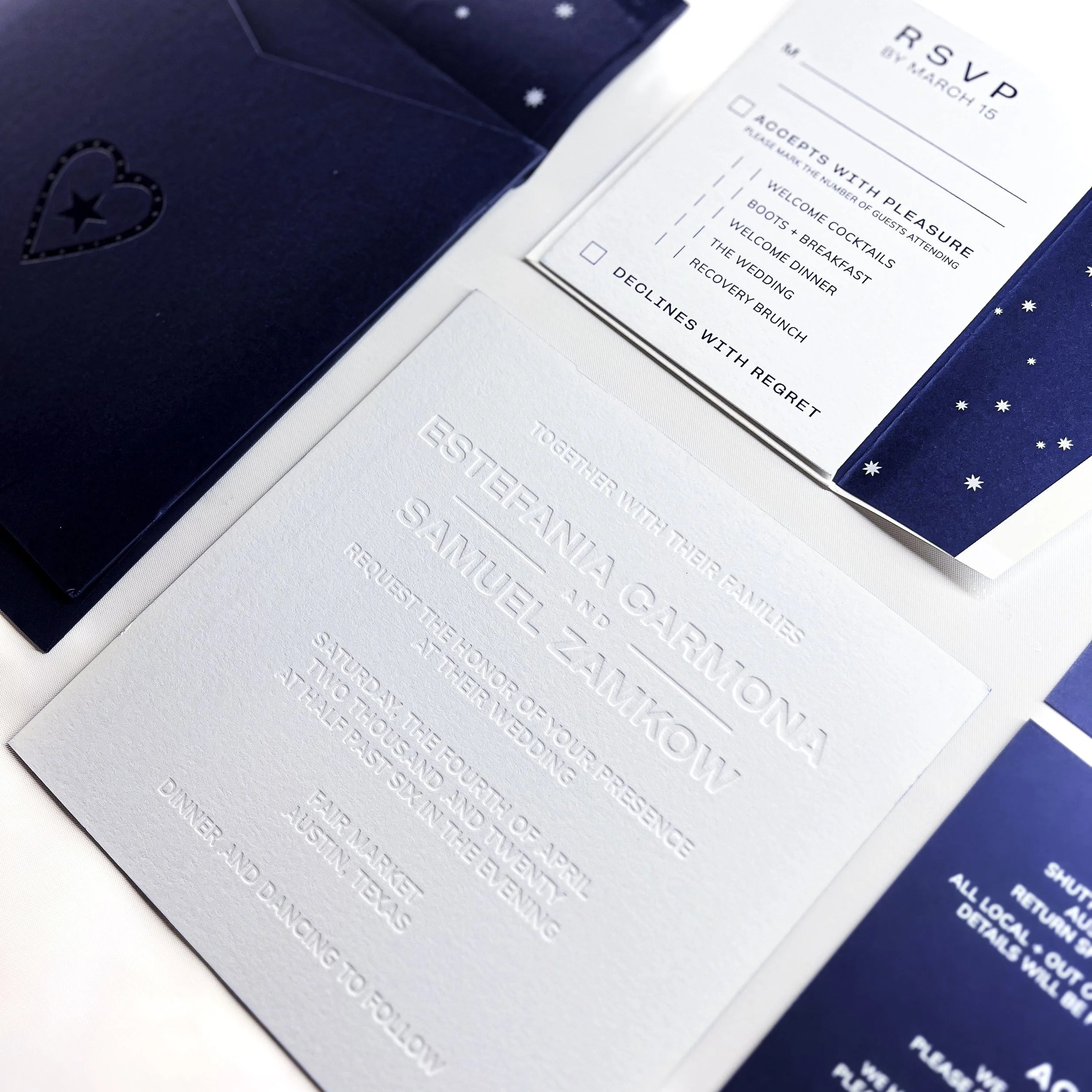 Close-up of a formal event schedule on a white and blue paper with an embossed snowflake pattern.