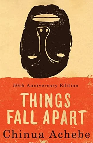 Book cover for "Things Fall Apart" by Chinua Achebe, 50th Anniversary Edition, featuring a black and white mask illustration on a beige background with an orange band at the bottom.